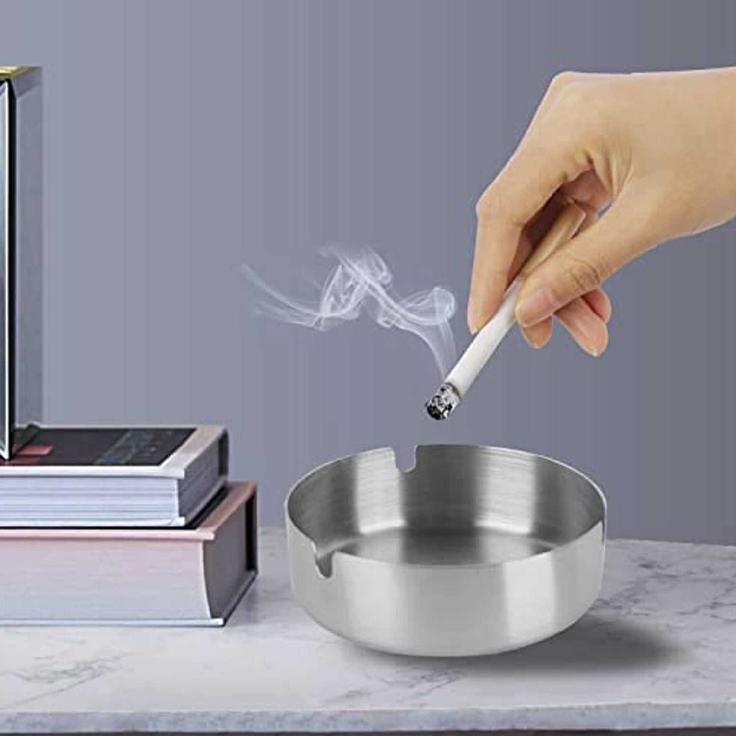 Round ashtray bowl featuring multiple cigarette rest slots