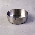 Stable tabletop ashtray with multiple slots for cigarette rests