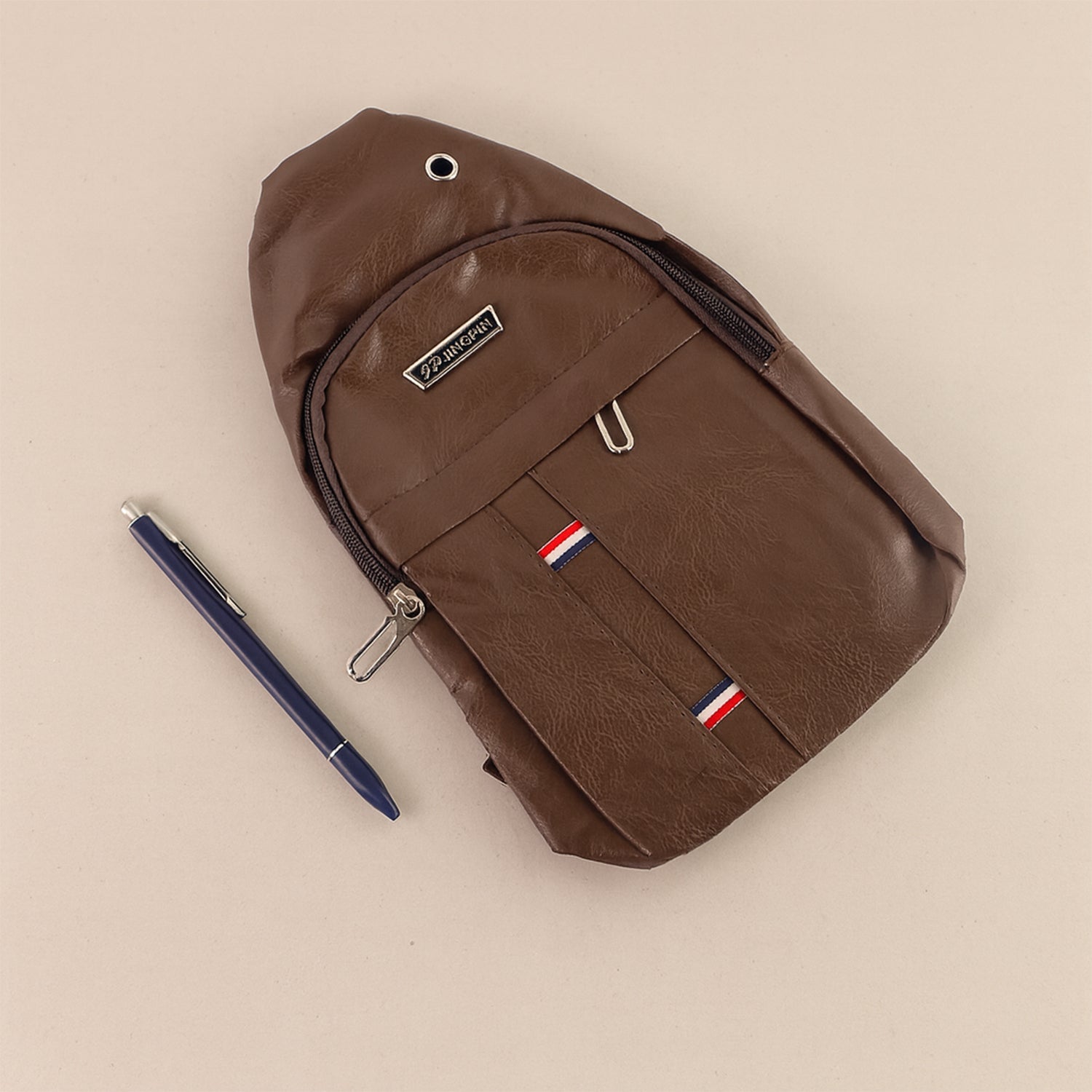 Comparison shot of the FERVENT anti-theft cross-body bag, demonstrating its ergonomic shape.