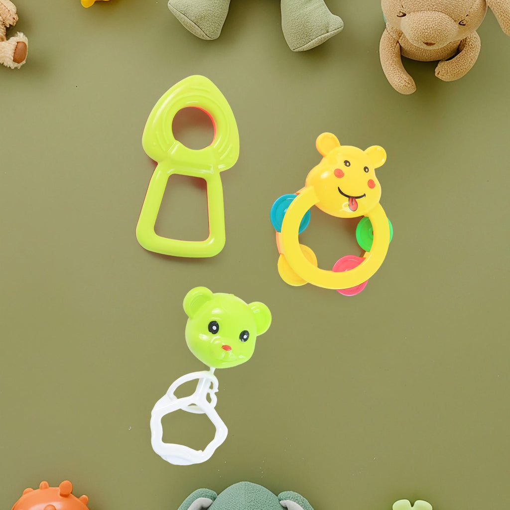 Complete eight-piece baby rattle collection set on white background