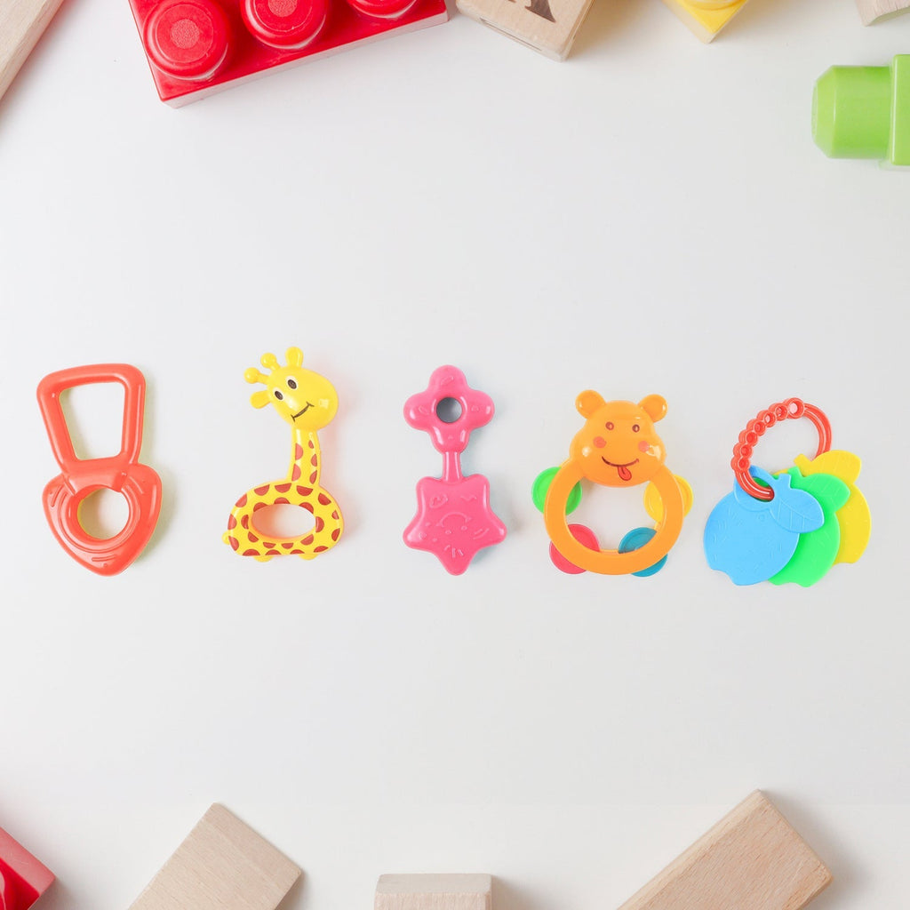 Baby rattle toy featuring friendly animal face for infant play