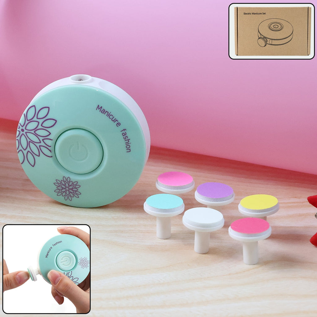 Baby electric nail trimmer with interchangeable grinding heads laid out
