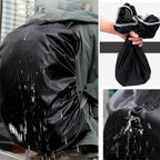 Adjustable elastic straps ensuring a snug and secure fit of the rain cover on a backpack.