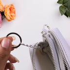 Small storage pouch with zipper and metal clip key holder