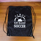 Drawstring Sport Backpack resting on a floor, ready for your next outing.