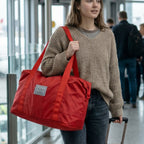 Red lightweight travel carry bag measuring 40x54 cm with stylish design
