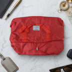 Exterior detail of stylish red travel carry bag