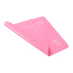 Compactly rolled-up silicone baking mat for easy storage and portability.