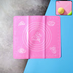 Non-stick silicone baking mat with measurement guides on a counter.
