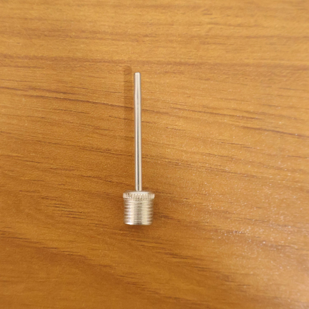 Ball pump needle adapter in use with sports ball pump