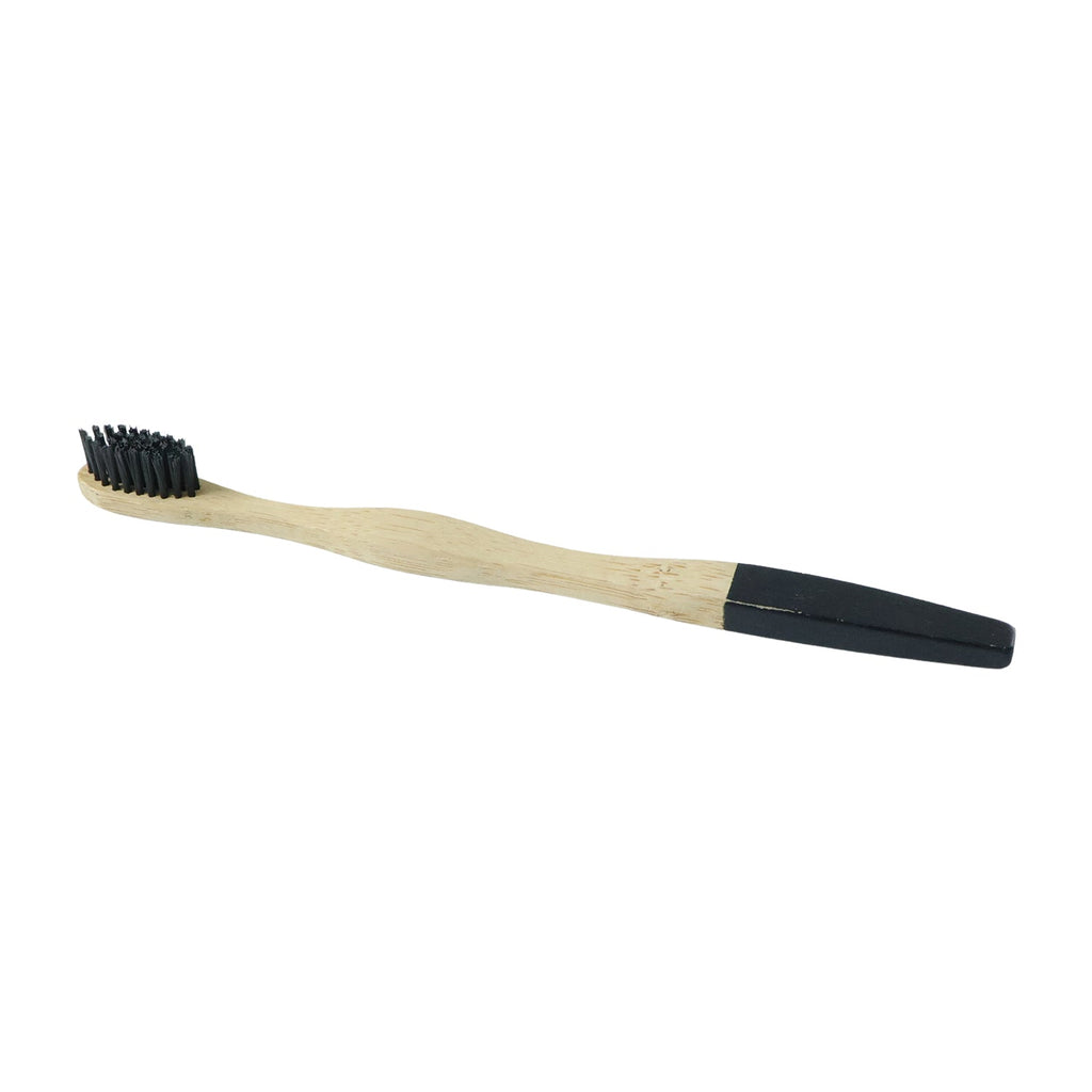 Bamboo toothbrush with soft charcoal bristles on a wooden handle