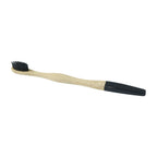 Bamboo toothbrush with soft charcoal bristles on a wooden handle