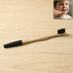 Natural bamboo toothbrush featuring soft charcoal-infused bristles