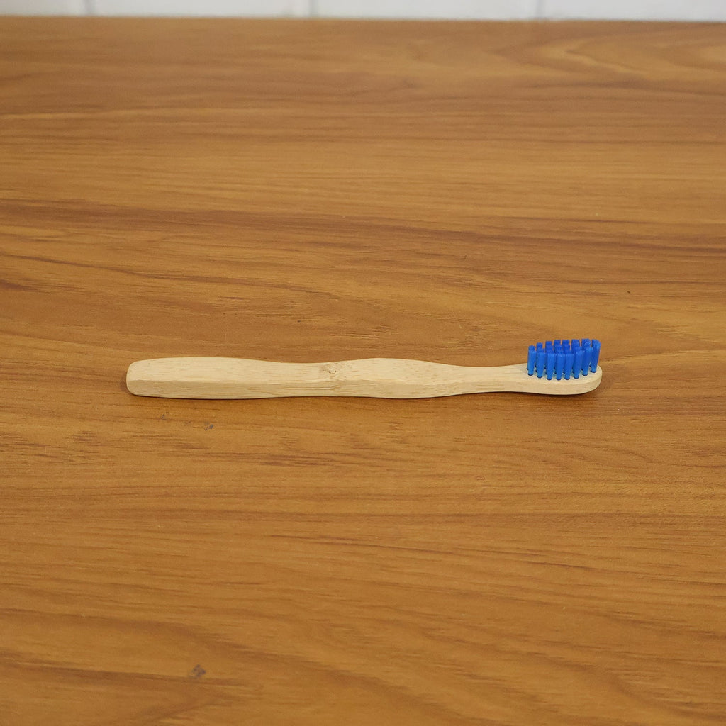 Wooden toothbrush in natural setting, eco-friendly material