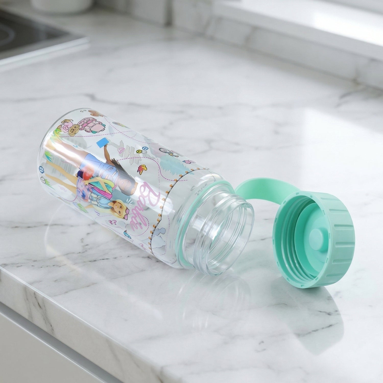 Kids water bottle hanging on strap for portability
