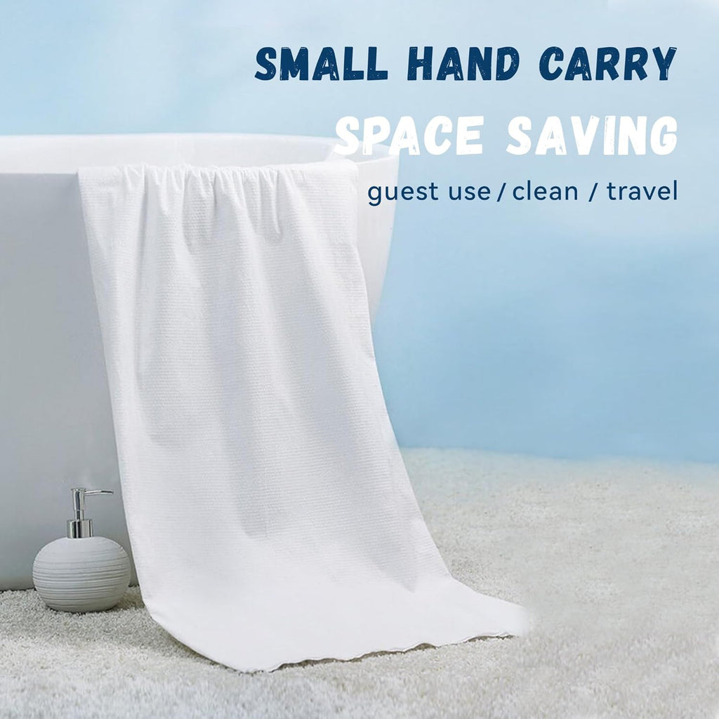 Compressed travel bath towel in expanded form lying flat