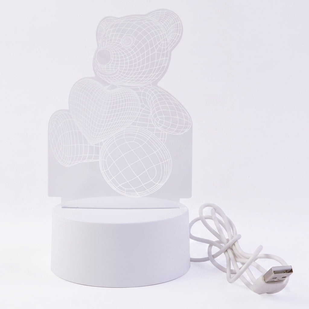 Teddy bear LED Night Lamp glowing softly in dark room