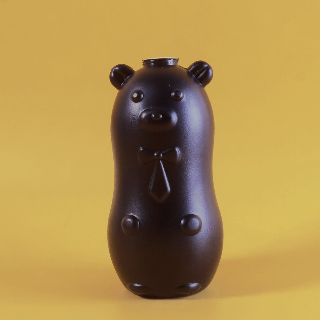 Bear shaped toilet tank cleaner close up view showing automatic cleaning features