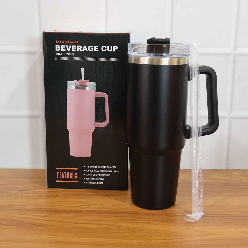 Lifestyle image with black insulated travel mug and coffee