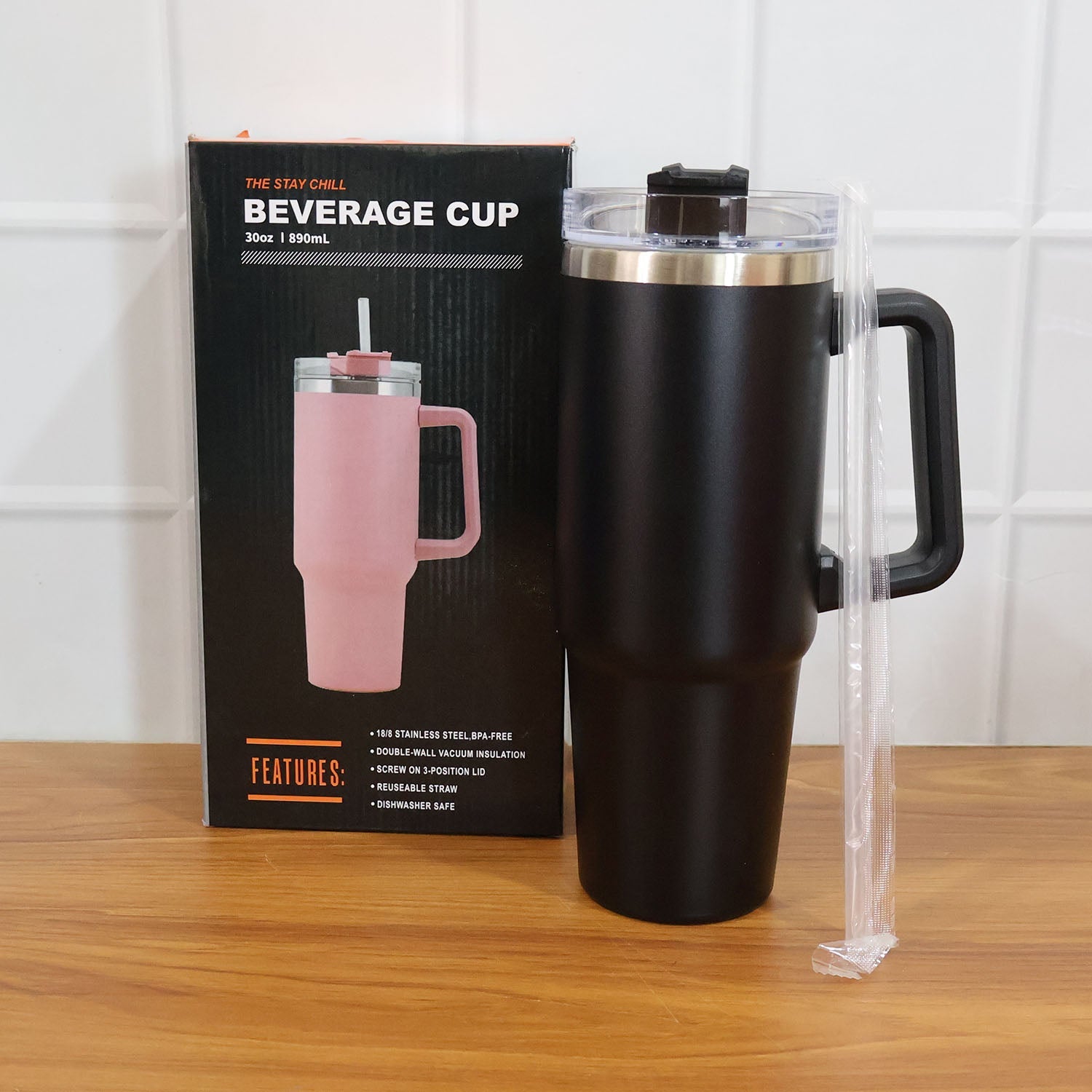 Lifestyle image with black insulated travel mug and coffee