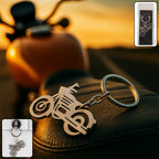 Sleek metal motorcycle keychain with a robust split ring for securing keys.