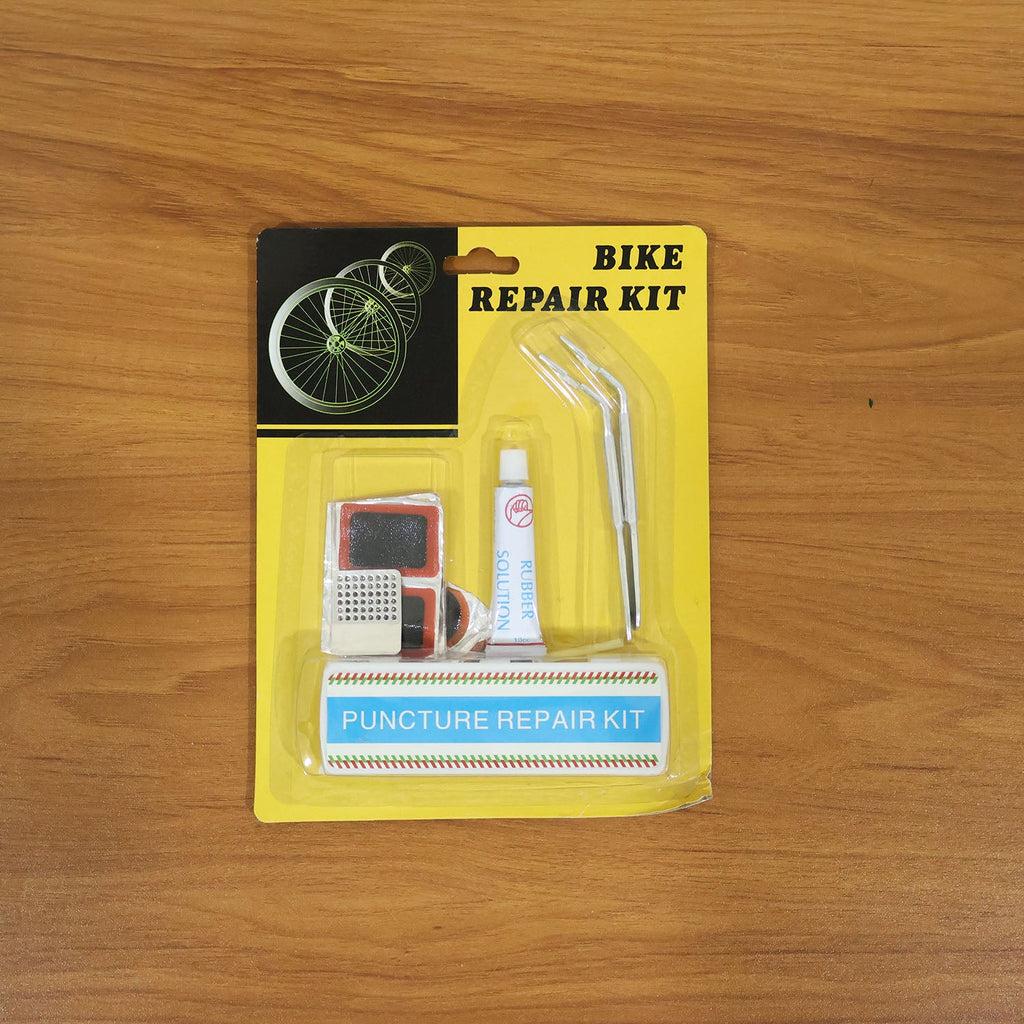 Demonstration of bicycle tire repair kit being used to fix a bike tire puncture