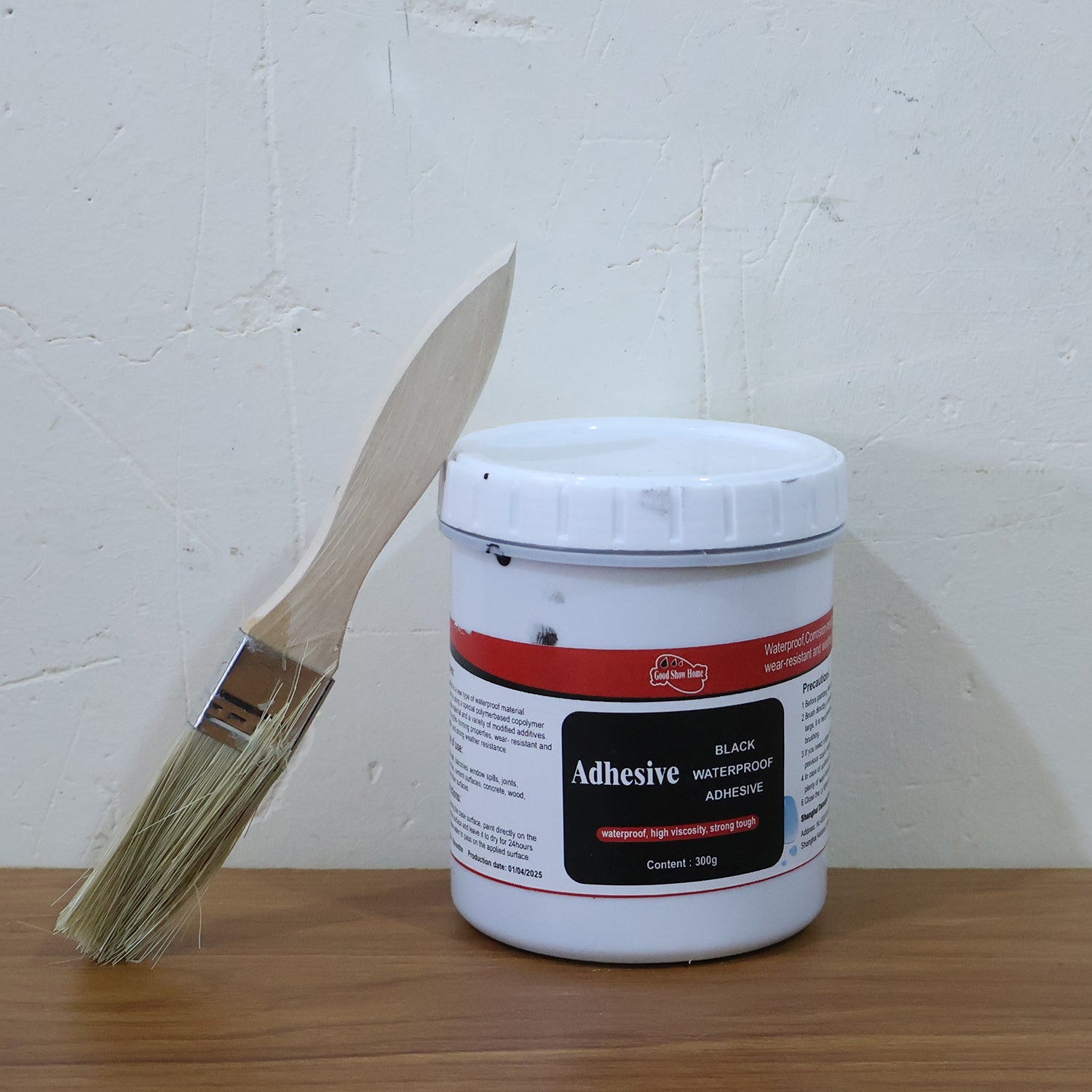 Live image showing black waterproof adhesive paste consistency and color