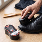 Black shine shoe polish with sponge applicator