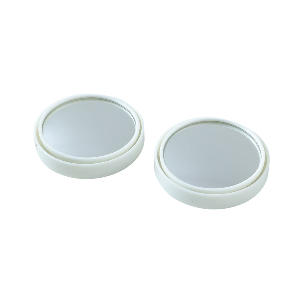 Close-up view of white round car blind spot mirror