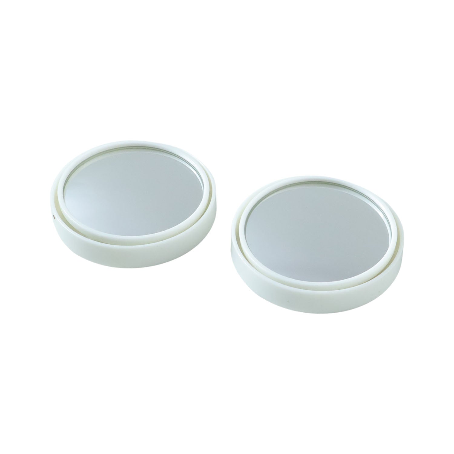 Close-up view of white round car blind spot mirror