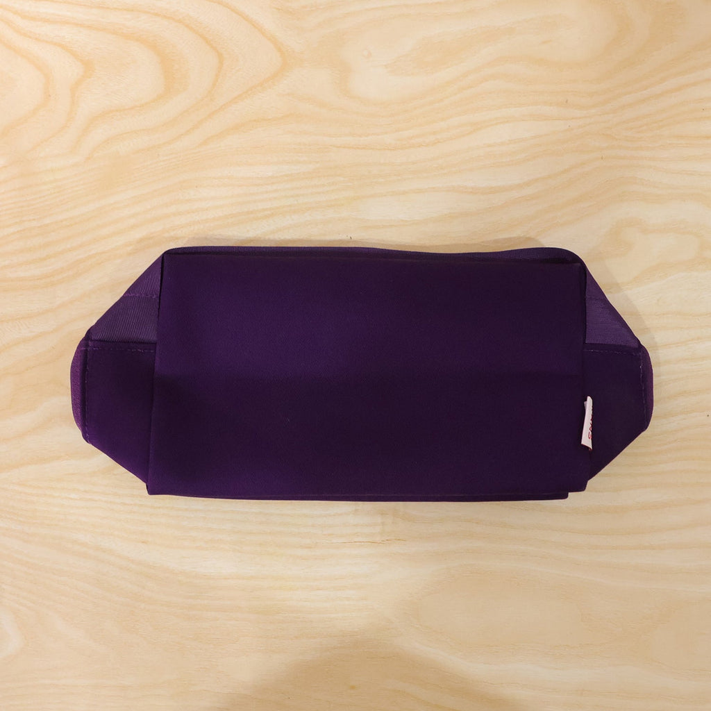 Travel makeup organizer bag in use, waterproof design