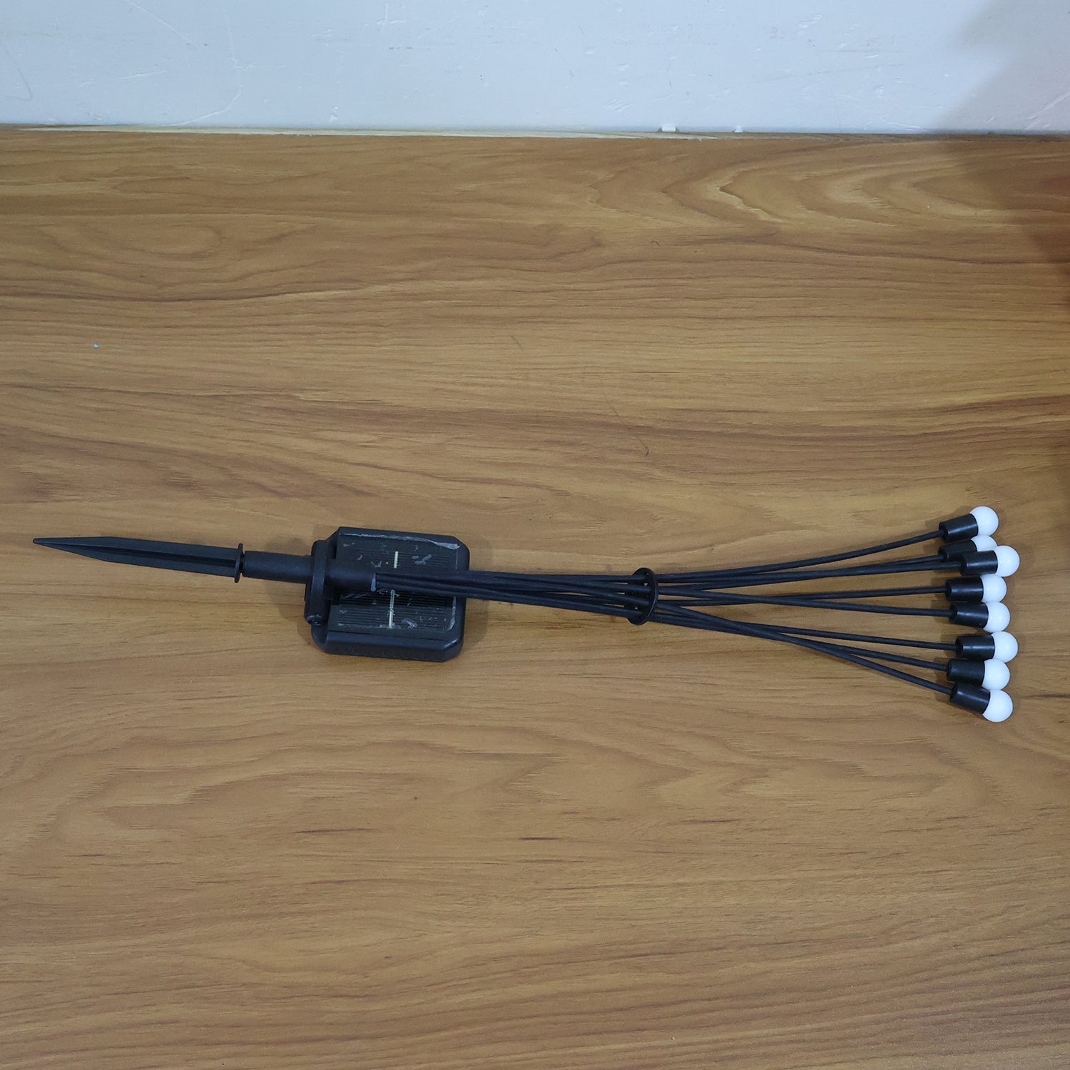 Solar fiber optic garden light illuminating balcony area