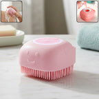 Silicone massage bath body brush with built-in soap dispenser in hand for gentle cleansing