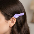 Close-up of colorful cartoon food hair pins for kids' hairstyles