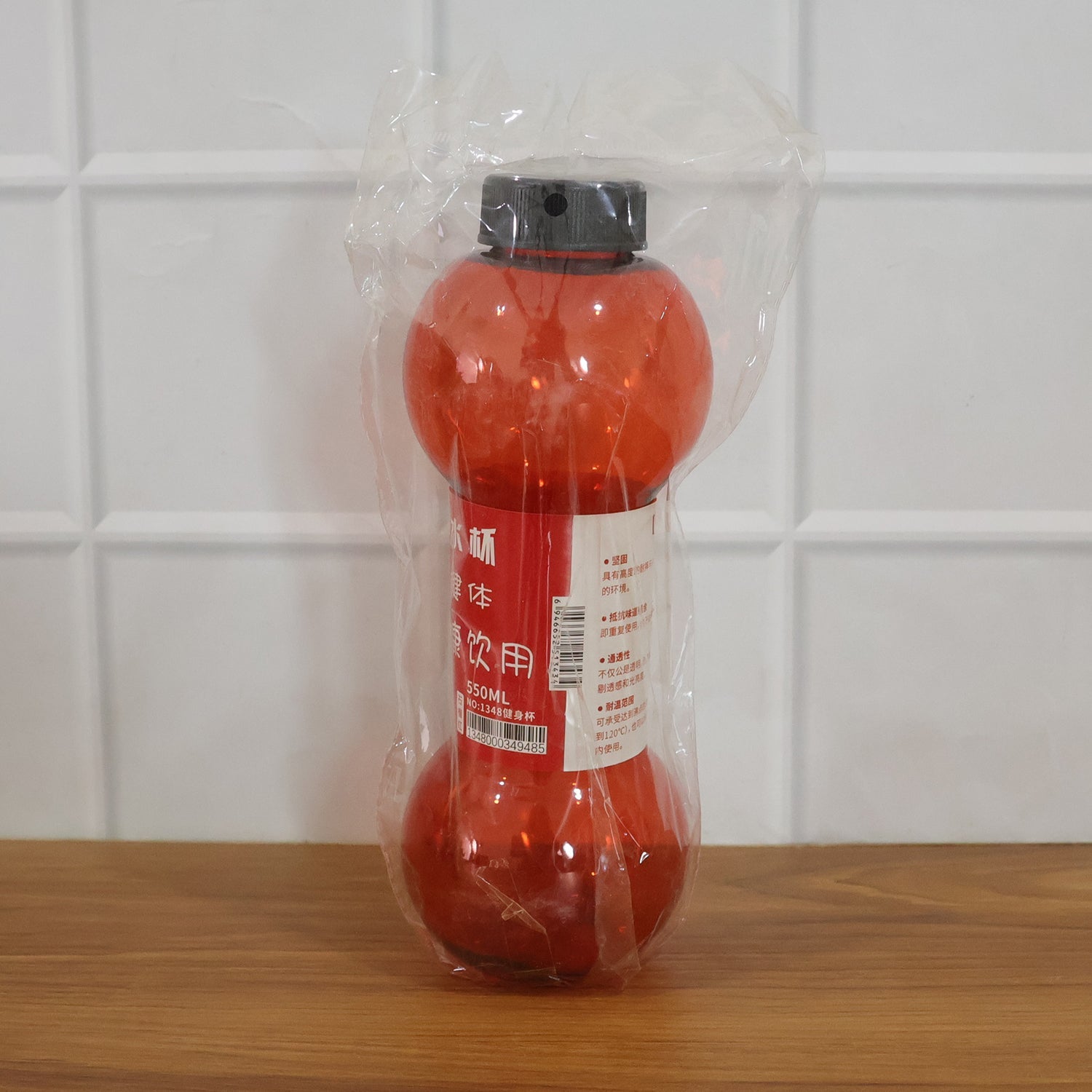 Stylish angled view of dumbbell shaped water bottle