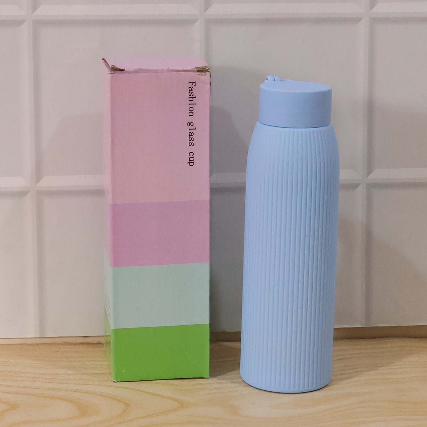 Stylish, lightweight blue textured glass hydration bottle for daily use