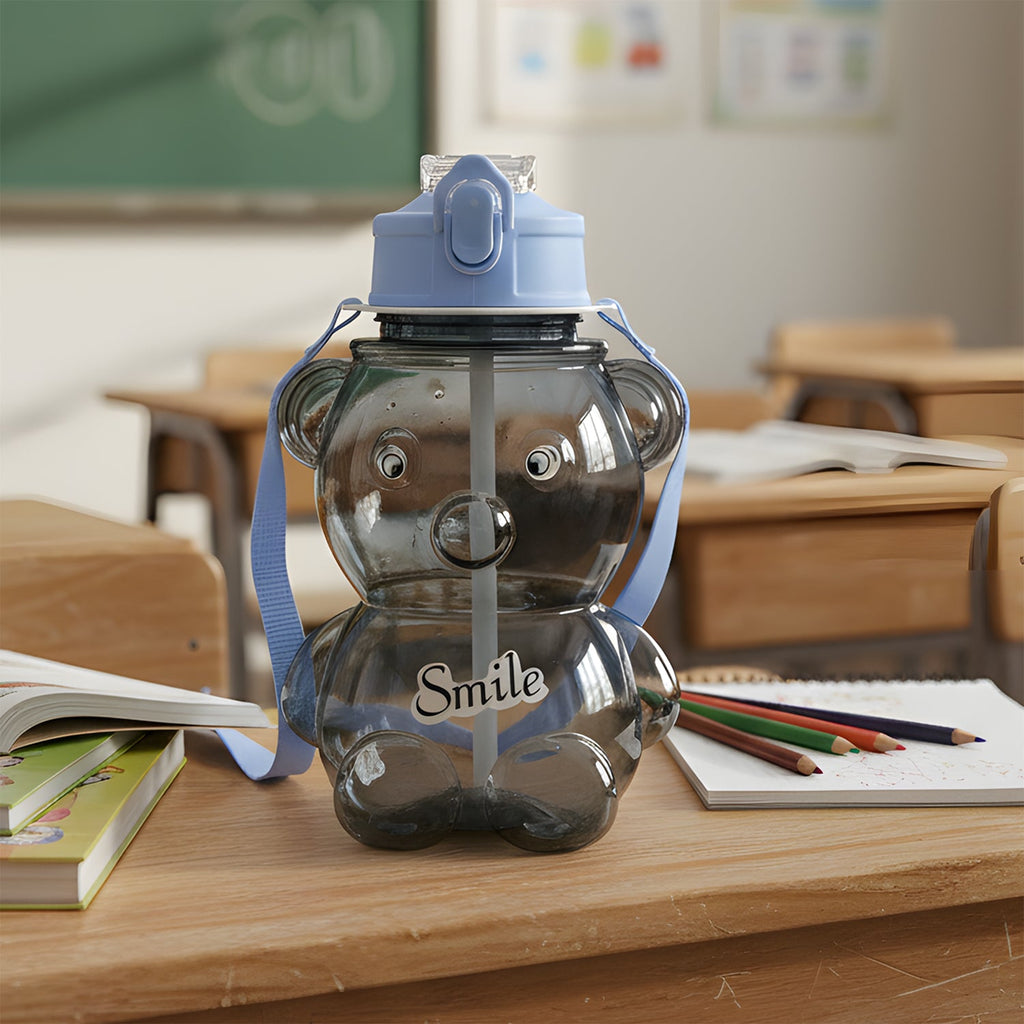 Transparent kids water bottle with cartoon bear design and flip-lock lid