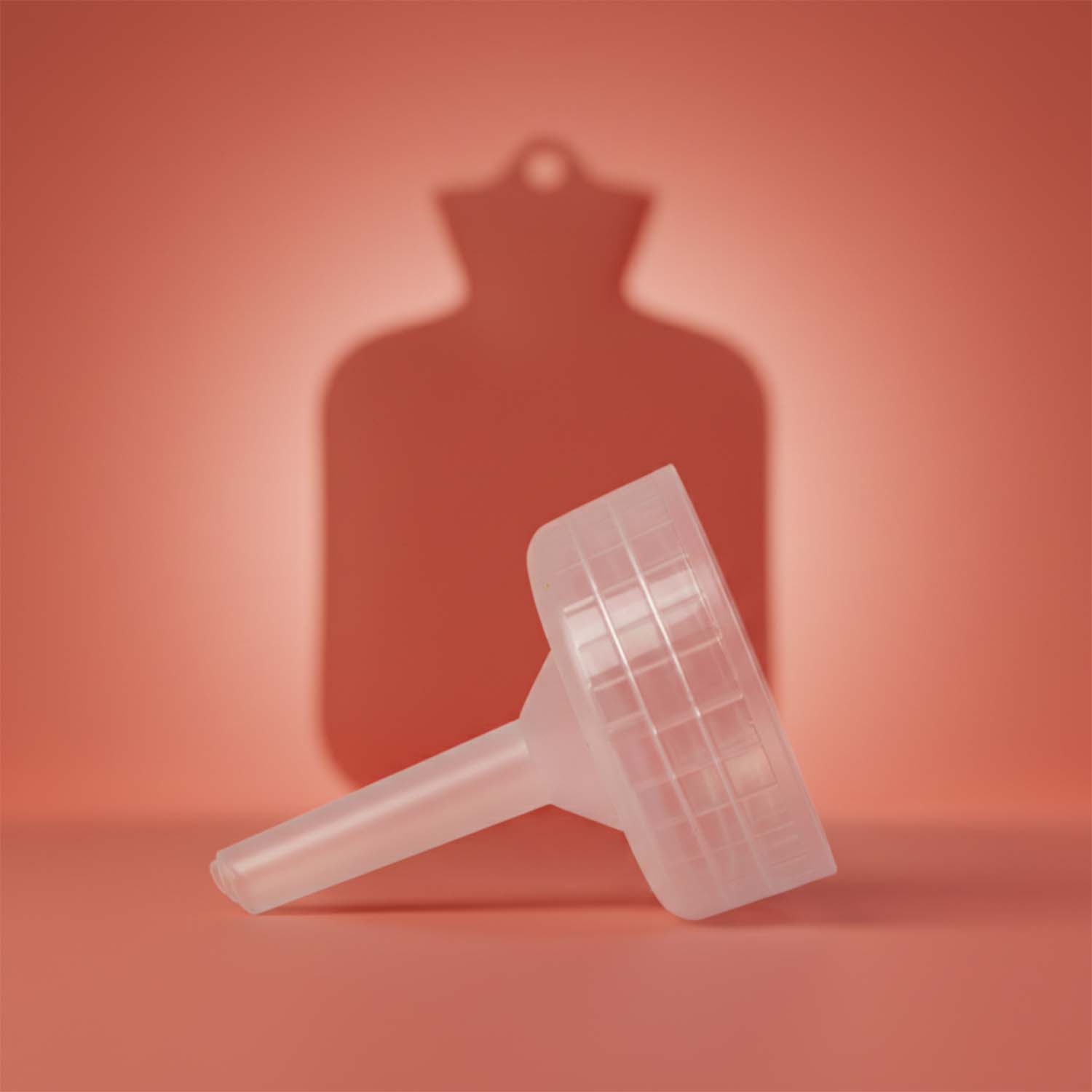 Hot water bottle filling with ergonomic funnel cap to prevent spills