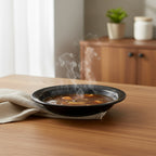Glossy black deep serving bowl designed for multiple dish types