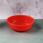Close-up of plastic red serving bowl perfect for salads and snacks