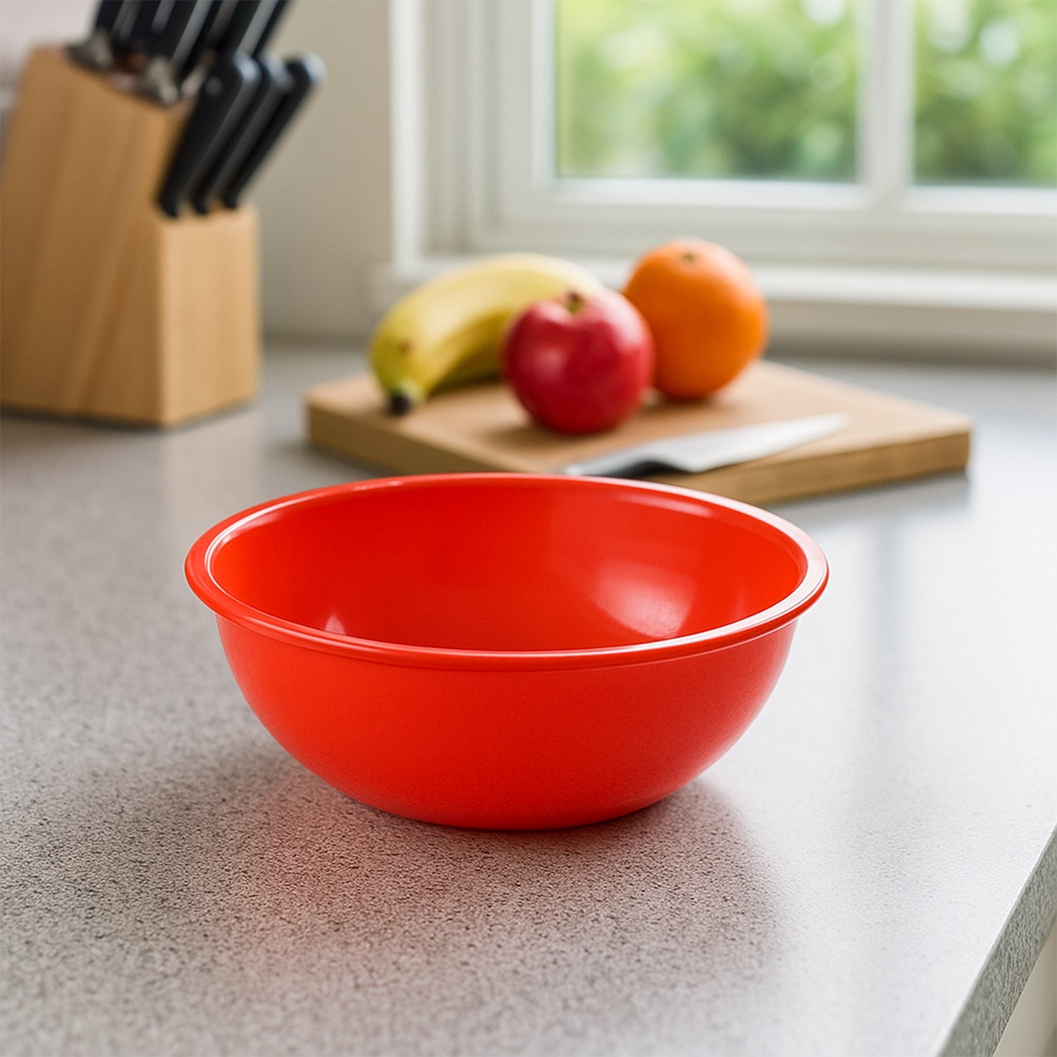 Stacked plastic red bowls showcasing lightweight design