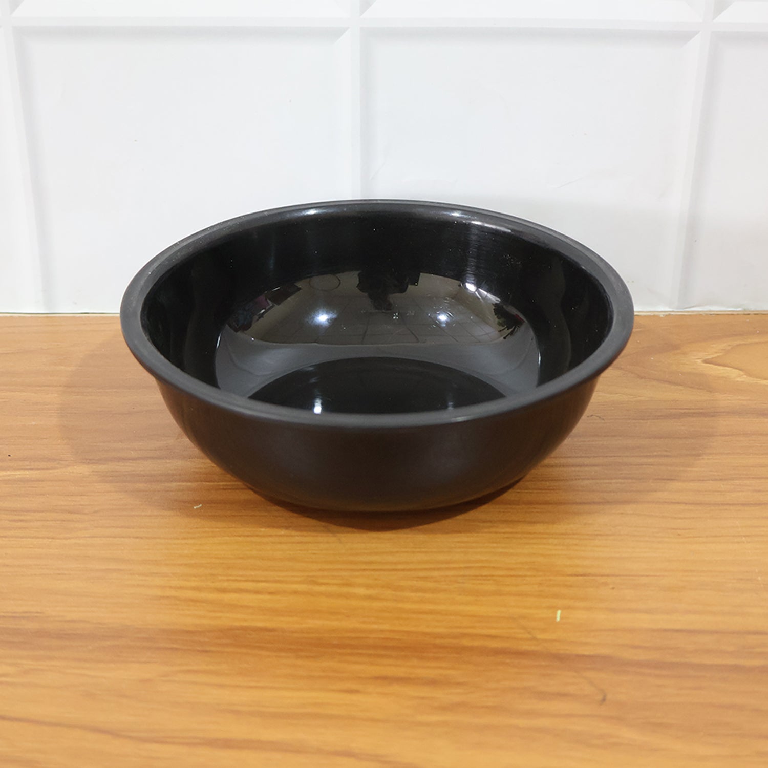 Close-up of texture on black plastic serving bowl