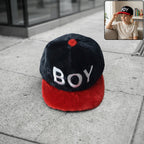 Boys printed fashion cap with letter design showing stylish casual headwear