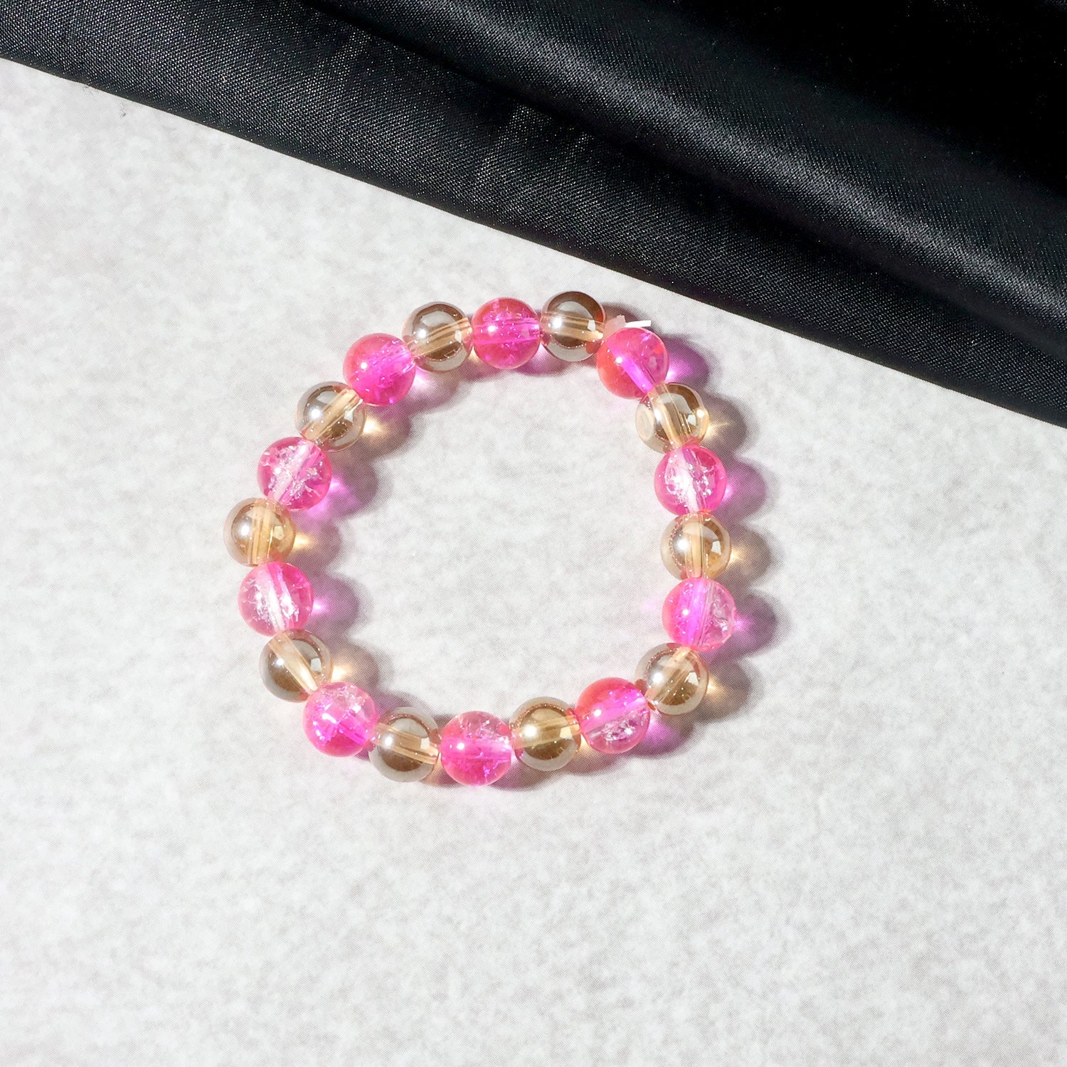 Close-up of crystal beaded bracelet featuring dual-tone design