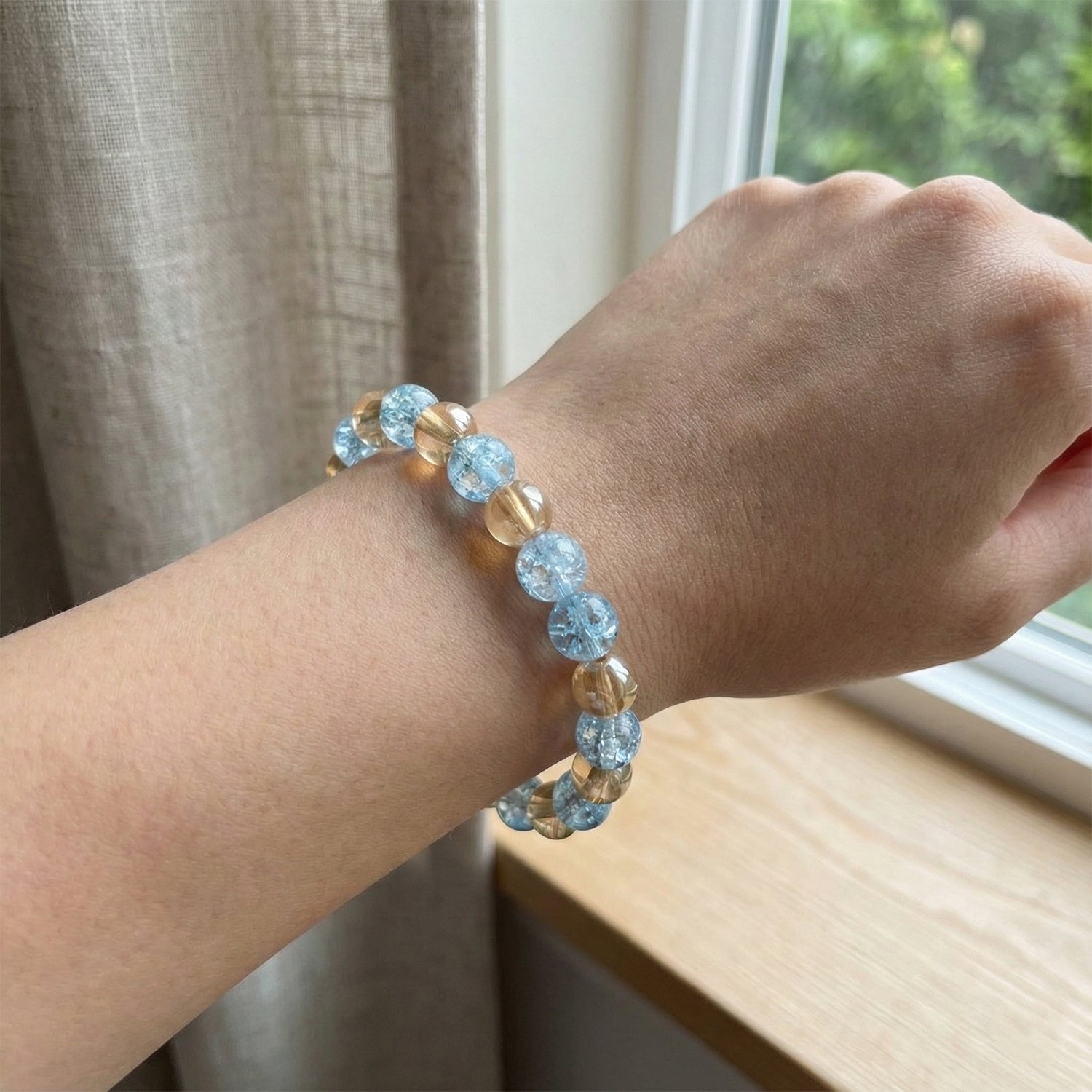 Angle view of stylish dual-tone beaded stretch bracelet