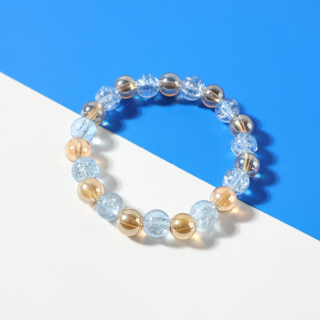 Highlighted details of dual-tone crystal stretch bracelet beads