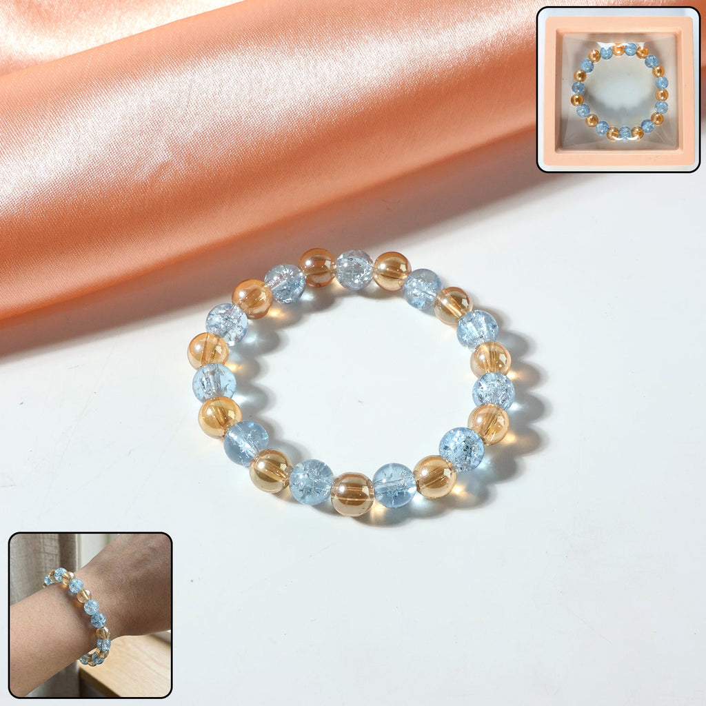 Front view of elegant dual-tone crystal beaded stretch bracelet