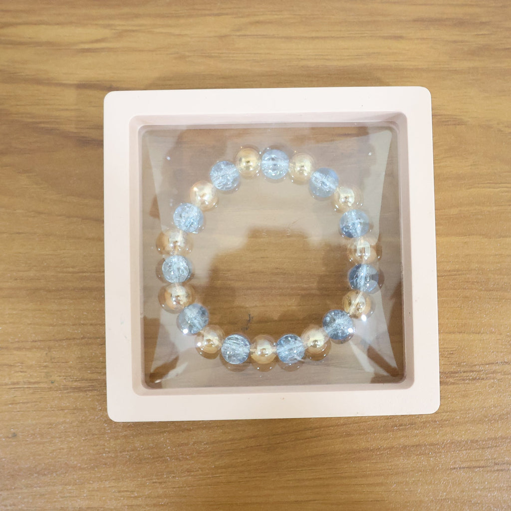 Live wrist view of elegant dual-tone crystal beaded stretch bracelet