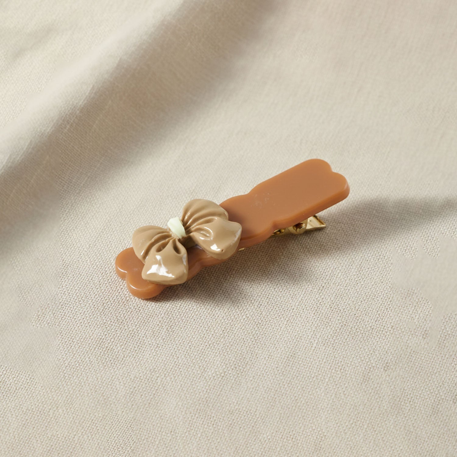 Multiple bow hair clips arranged showcasing smooth edges