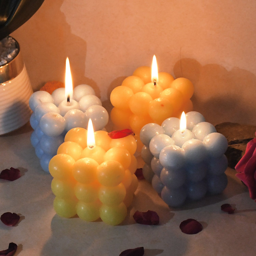 Decorative wax cube candles arranged to enhance festive ambience